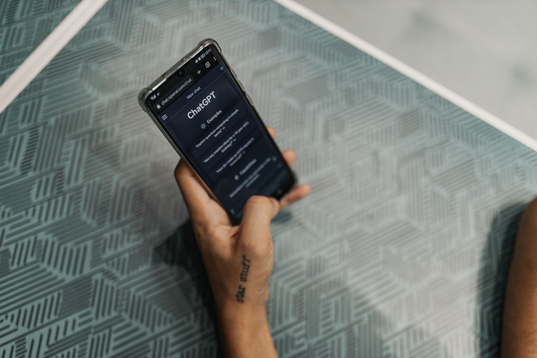 Hands holding a smartphone with a chat app open